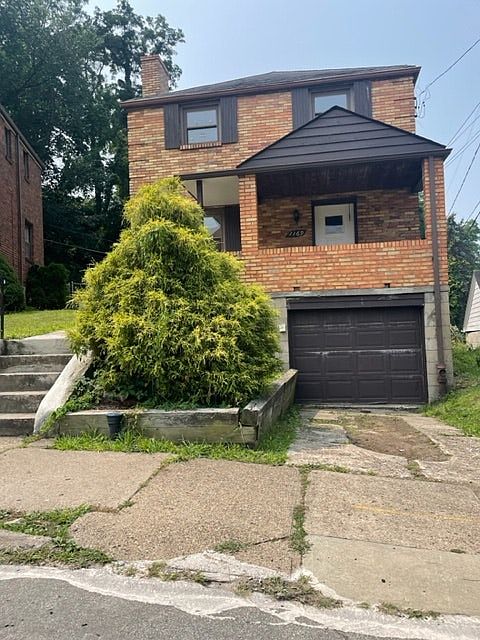 Front of the all brick well maintained home