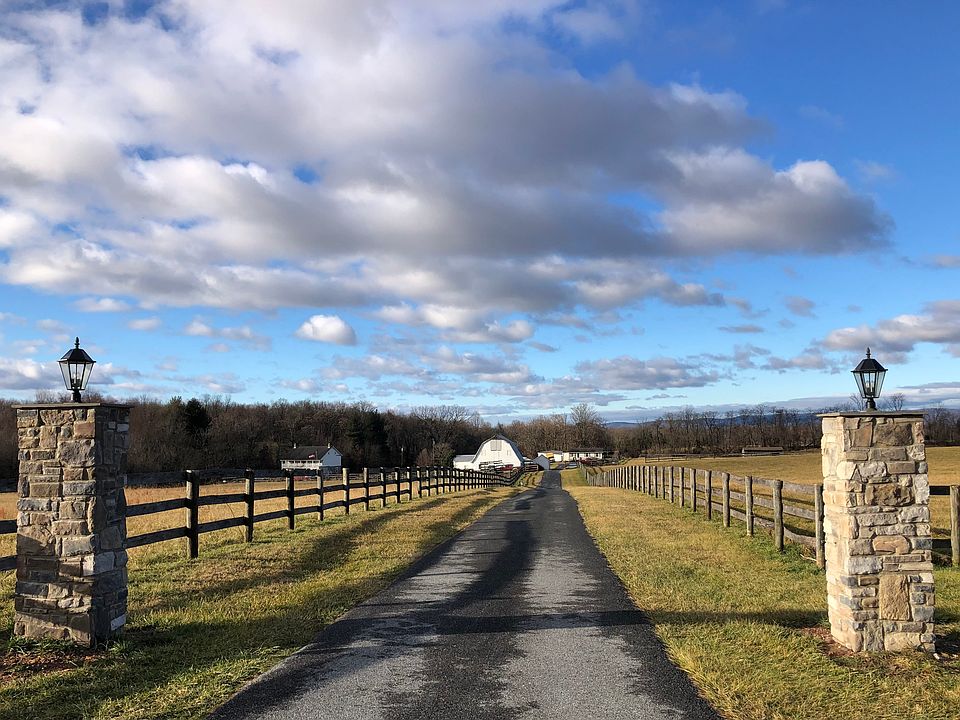 Entrance. Rental home is straight back and to the right of the barn. Shown by appointment only.