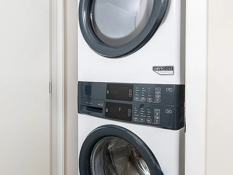 Experience the convenience of a stylish and efficient laundry corner.