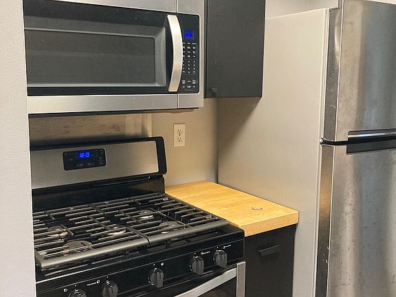 Range with microwave hood over the range.