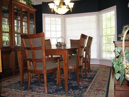 Elegant dining room with hardwood floors.