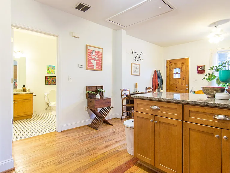 Kitchen to living room and communial bathroom.