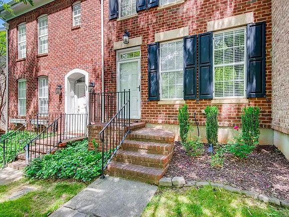 Brick Front with black shutters.