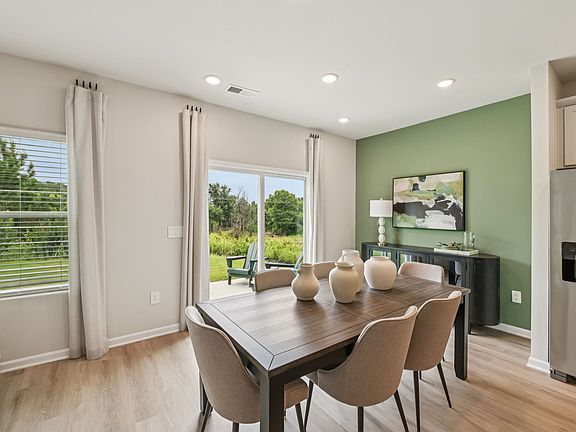 Dining area in the Chatham floorplan at a Meritage Homes community in Mebane, NC.