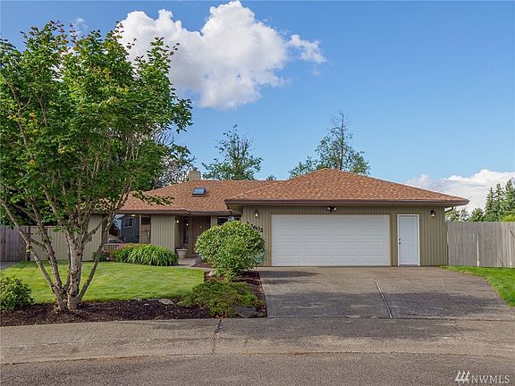 Hard to find rambler in North Peak Crest neighborhood. An extra wide garage fits two cars (and loads of toys for all ages).