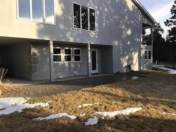 Rear view of home with private walkout.
