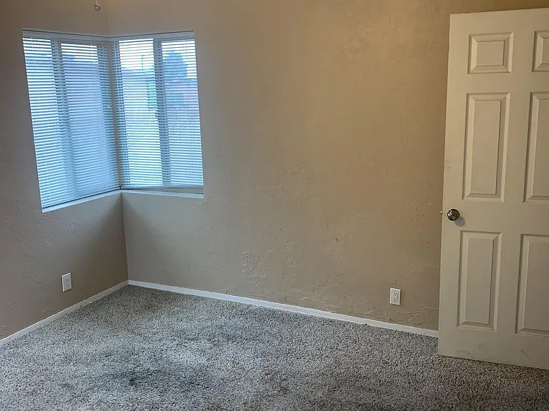 Bedroom with front facing windows