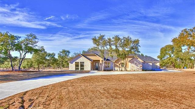 Stunning home on heavily treed lot with views.