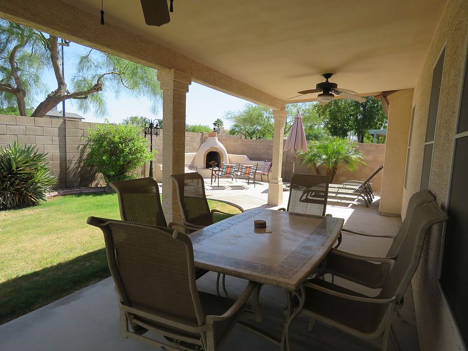 Covered backyard patio, outdoor fireplace