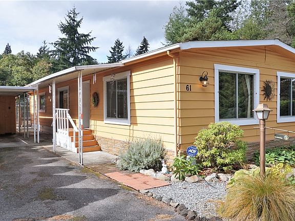 Carport & deep driveway. 
