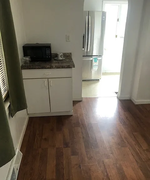 View from dinning room into largest kitchen
