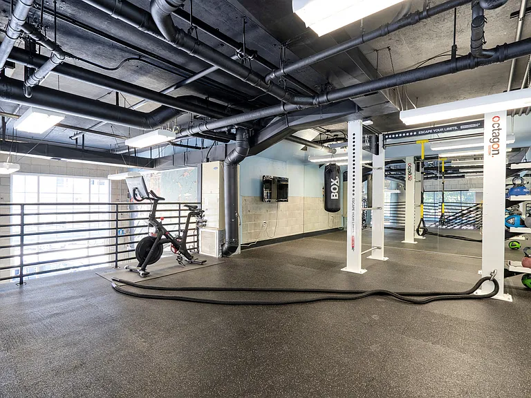 The upstairs features a Peloton bike, and a great space for training