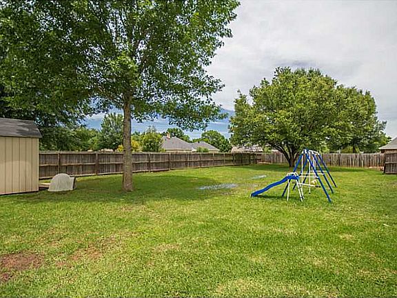 Large backyard with storage unit