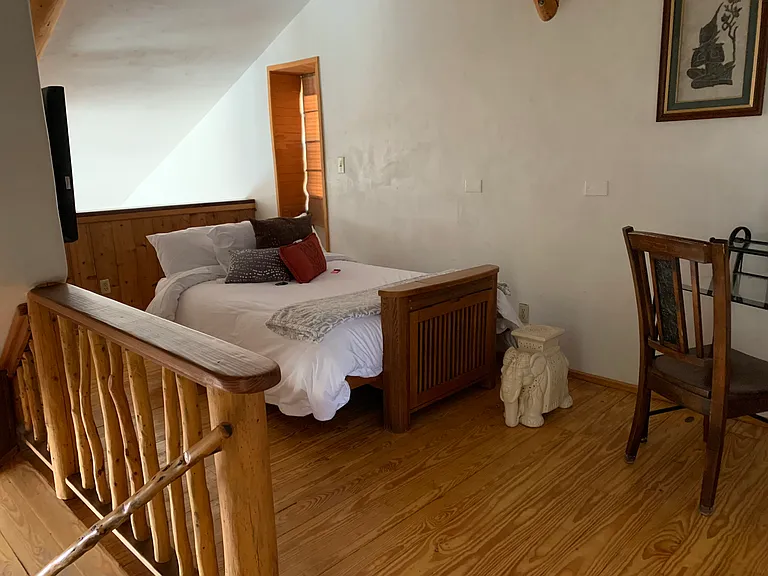 Upstairs loft with futon made into bed