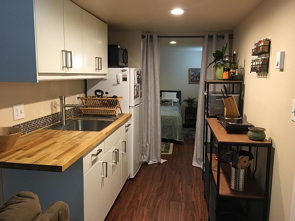 kitchenette showing bedroom beyond