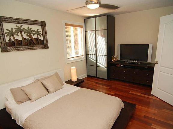 Spacious bedroom with custom closets