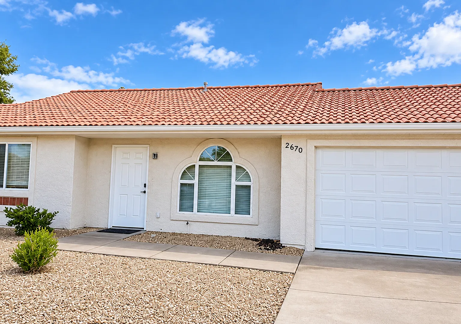 Single-Level 2-Bedroom Townhome with a Fenced Backyard & 2-Car Garage — Photo 1