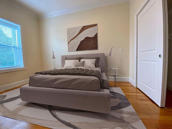 Primary bedroom off of the kitchen. Large closet. High Ceilings throughout the condo