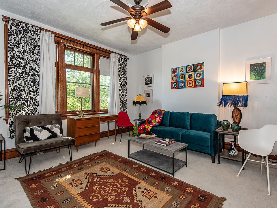 Period furniture, new seating, original art, handwoven wool rug: This apartment is a gallery!