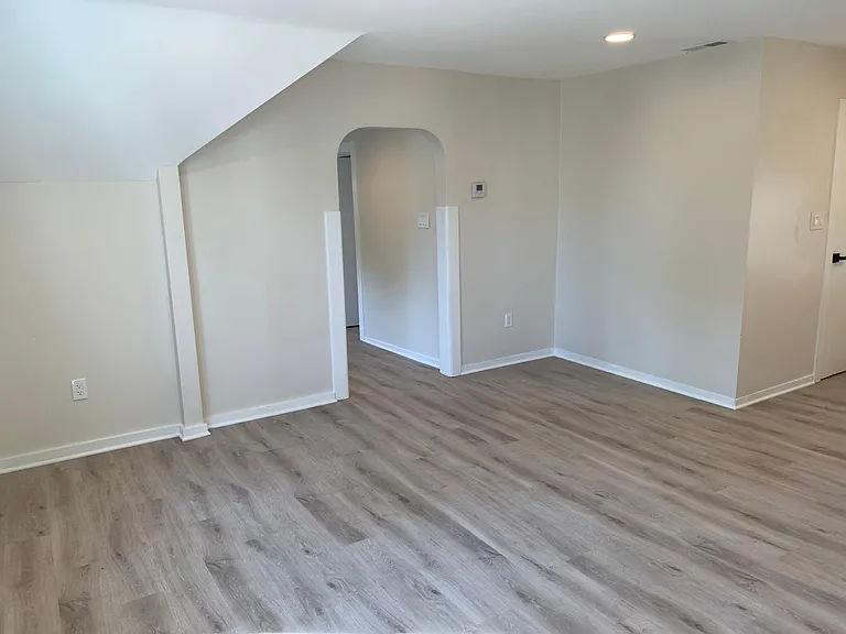 Living room with entry to kitchen
