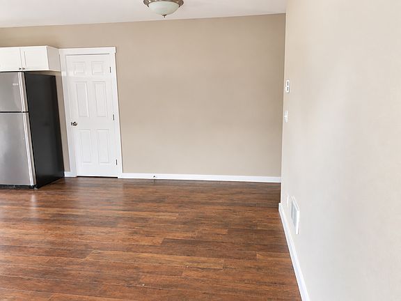 Pantry door and hallway to upstairs.