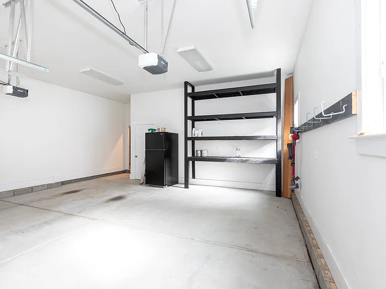 2 car garage w/shelving and hooks