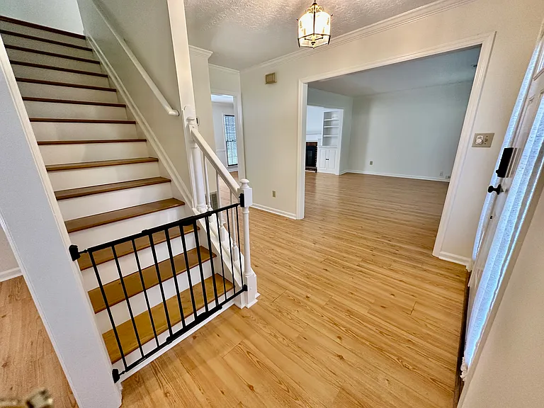 Foyer view into the den and stairs.