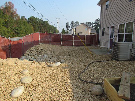River rocked backyard.