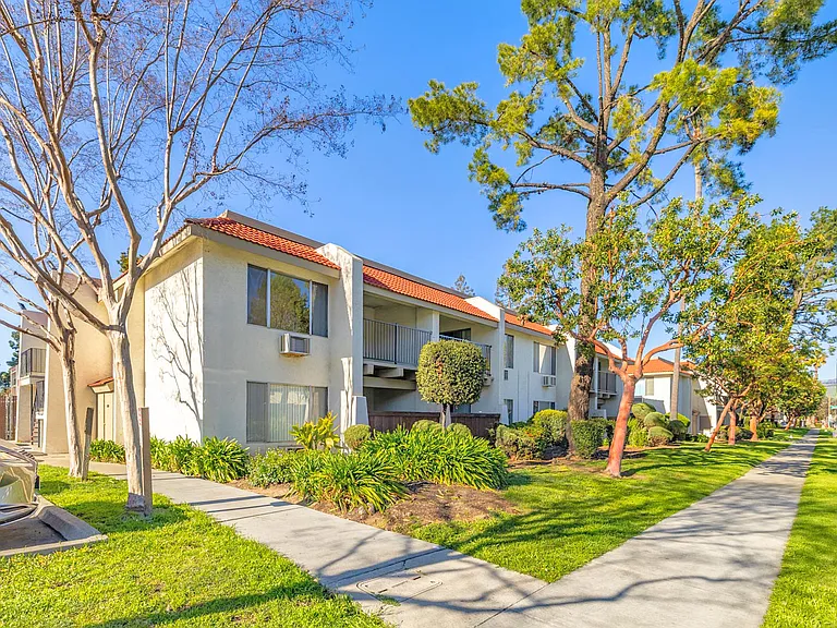 Welcoming community with lush landscaping and bright walkways.