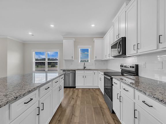 The wood cabinets have black hardware