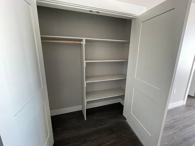 Oversized coat/storage closet at front of the apartment