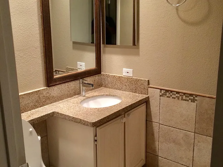 Half bath located central on upper floor next to living room.