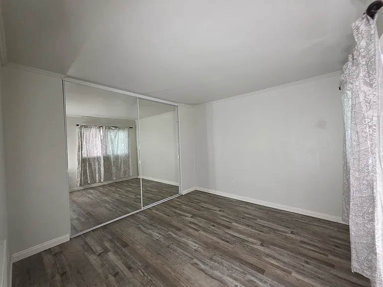 large closet with sliding doors