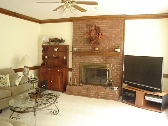 Family room with masonry fireplace and gas logs