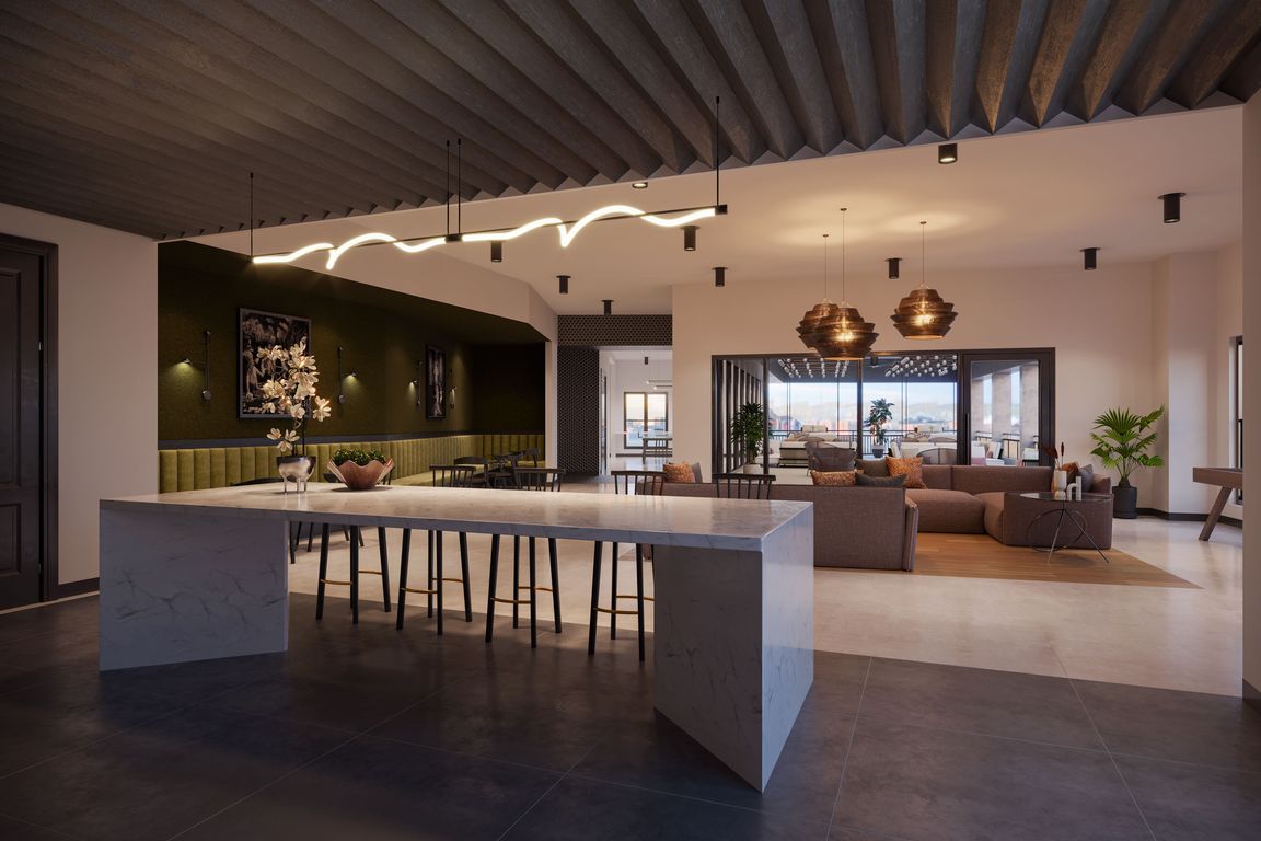 The 6th-floor roof lounge comes with a kitchen and outdoor space, providing a perfect setting for socializing.