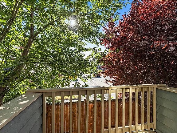 Outdoor balcony (with fenced private yard below it).