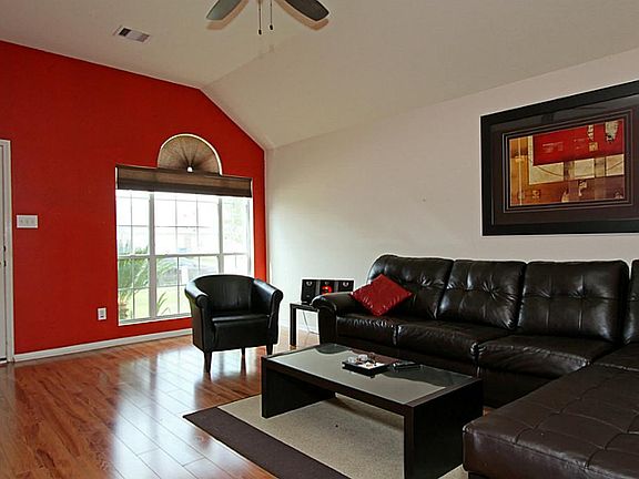 New laminate wood floors, large window that lets the natural light in, and a high sculpted ceiling a