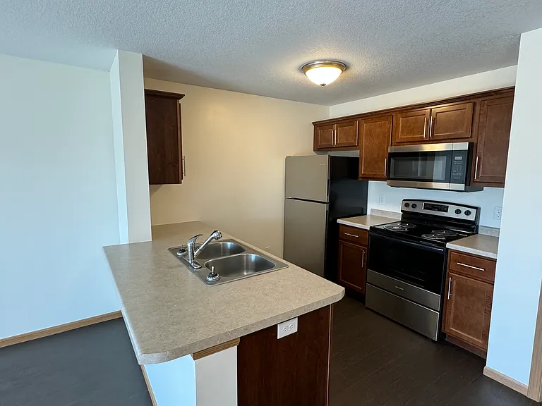Kitchen, includes: Electric Stove/Oven, Refrigerator/Freezer, Dishwasher and Microwave.