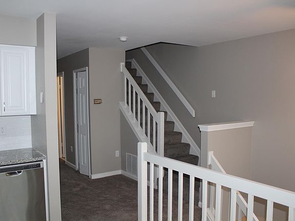 View towards Powder Room, Coat/Storage Closet and Stairs to 3 Upstairs Bedrooms
