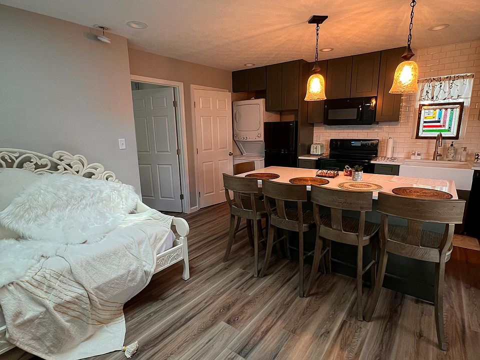 Main studio space with skylight for extra light. Guest in this bed can pull the skylight shade at night and blackout curtains will also be provided. The shared space also contains a comfortable chair and spacious counter for dining.