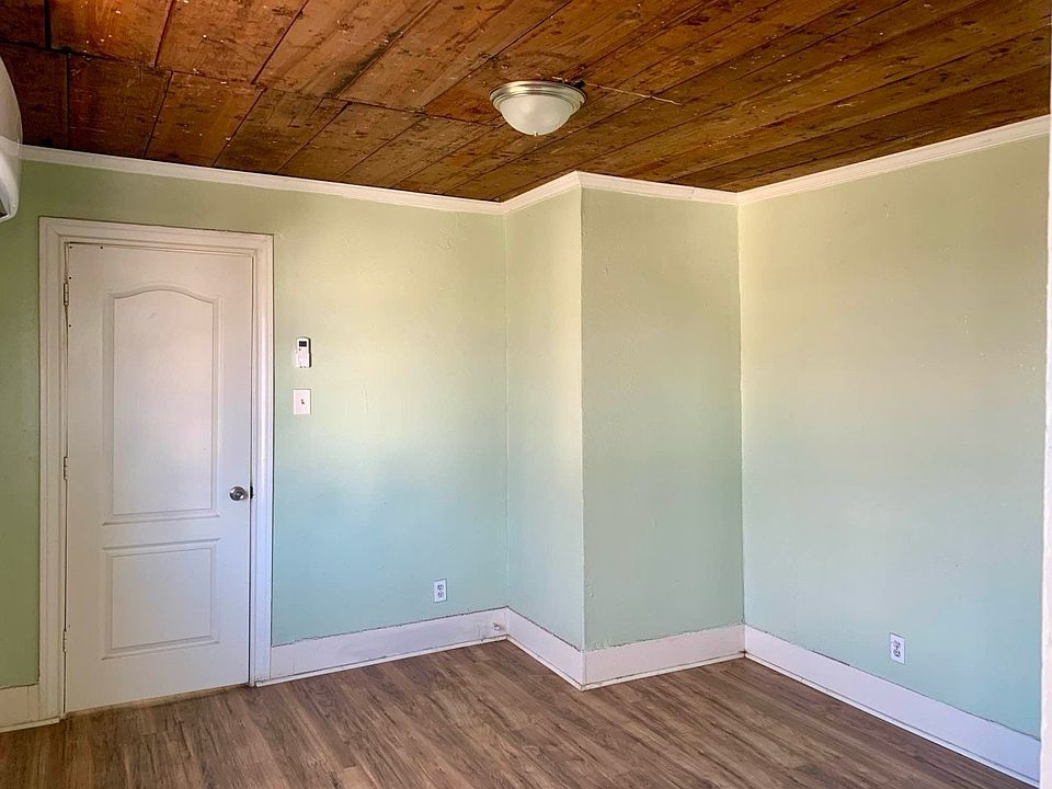 Living room boasting natural light and laminate flooring