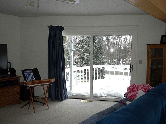Living Room with sliders to Composite Deck