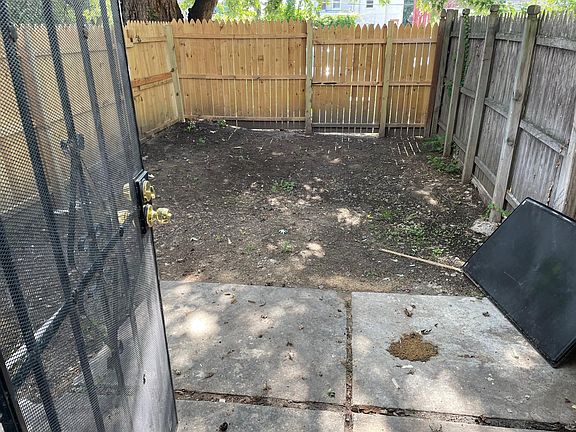 Fenced in backyard with parking in rear