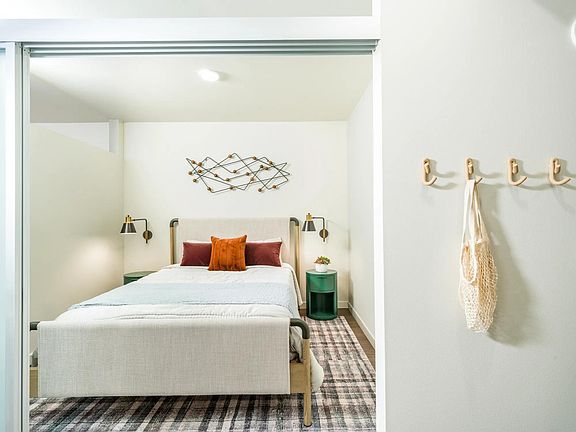 Discover a peaceful haven in the roomy bedrooms at Modera Northgate, designed to be your personal sanctuary with ample space and thoughtful touches for ultimate relaxation.