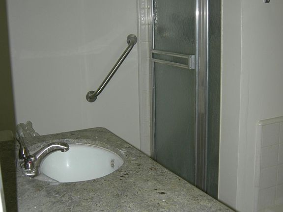 View into bathroom, separate tub and shower