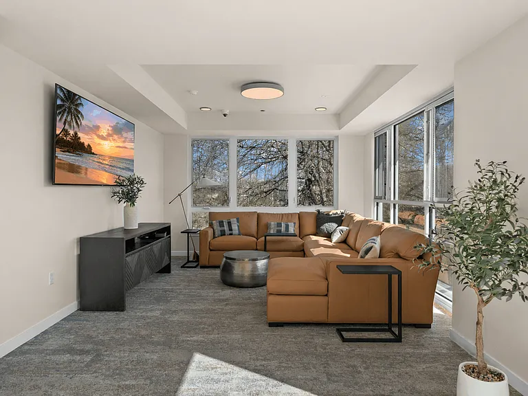 Cozy resident lounge in Sumner, WA with comfortable seating and abundant natural light.