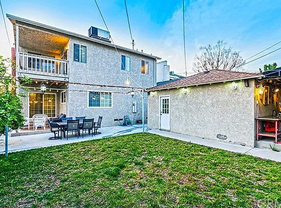 Great back yard with BBQ area, lots of fruit trees, nice size grassy area, 2 patios and much more.