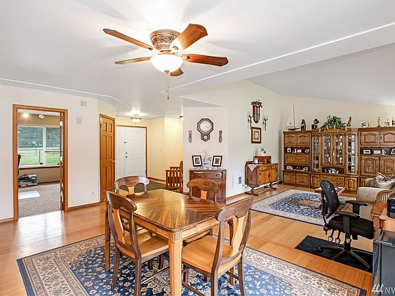 Another view of the formal dining and living rooms. Looking back toward the front entry (white door). Office just to the left of the entry