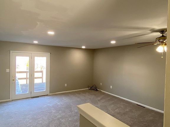 Family Room with recessed lighting and fan - New Carpet throughout