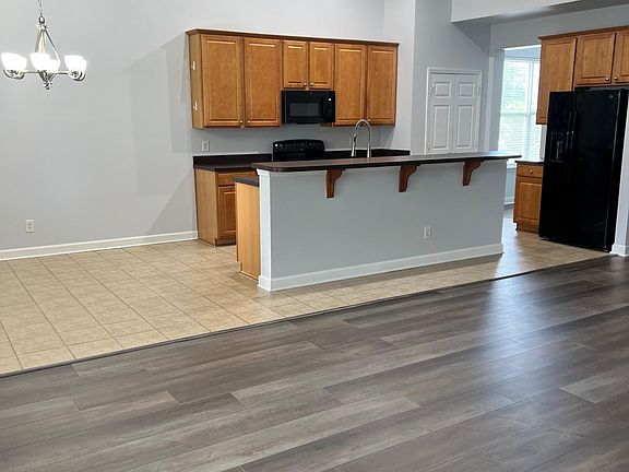 kitchen/informal dining, family room in foreground